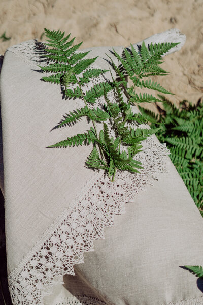 Linen table cloth with wide lace